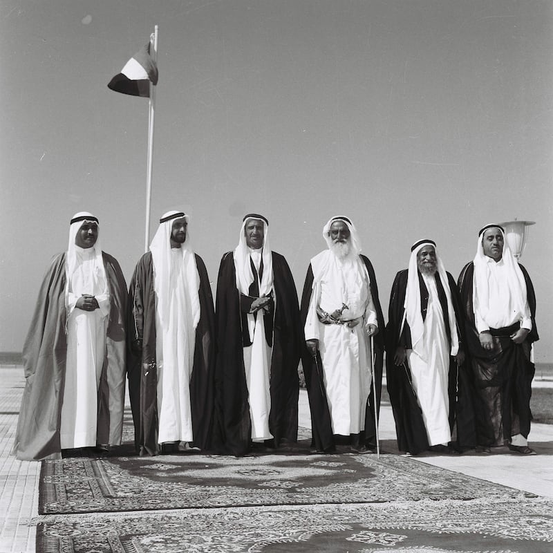 History Project 2010, "The First Day". Sheikh Zayed and UAE rulers at Union House in Dubai. December 2, 1971. Sheikhs pictured from left-right :
Sharjah - Sheikh Khalid Al Qasami, Abu Dhabi - Sheikh Zayed Al Nayhan (born 1981), Dubai - Sheikh Rashid Al Maktoum (born 1912) , Ajman - Sheikh Rashed Al Nuami (born 1902) Fujeirah - Sheikh Mohammed Al Sharqi, UAQ - Sheikh Ahmed Al' Mu'alla. 
