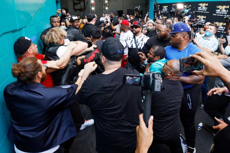 MIAMI GARDENS, FLORIDA - MAY 06: Floyd Mayweather, Jake Paul and Logan Paul scuffle after Jake took Mayweather's hat. AFP