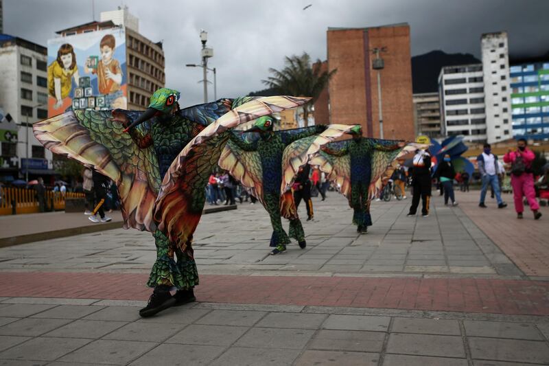 Actors dressed as hummingbirds perform on the streets, flapping their wings during a mayoral campaign to promote social distancing,  in Bogota, Colombia. Reuters