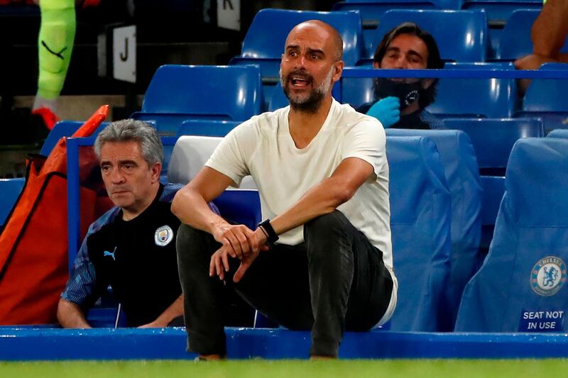 Manchester City's Spanish manager Pep Guardiola reacts during the English Premier League football match between Chelsea and Manchester City at Stamford Bridge in London on June 25, 2020. Cheslea won the match 2-1. Jurgen Klopp's legendary status at Anfield was secured on Thursday as he became the first Liverpool manager to win a league title in 30 years. - RESTRICTED TO EDITORIAL USE. No use with unauthorized audio, video, data, fixture lists, club/league logos or 'live' services. Online in-match use limited to 120 images. An additional 40 images may be used in extra time. No video emulation. Social media in-match use limited to 120 images. An additional 40 images may be used in extra time. No use in betting publications, games or single club/league/player publications.
 / AFP / POOL / POOL / PAUL CHILDS / RESTRICTED TO EDITORIAL USE. No use with unauthorized audio, video, data, fixture lists, club/league logos or 'live' services. Online in-match use limited to 120 images. An additional 40 images may be used in extra time. No video emulation. Social media in-match use limited to 120 images. An additional 40 images may be used in extra time. No use in betting publications, games or single club/league/player publications.
