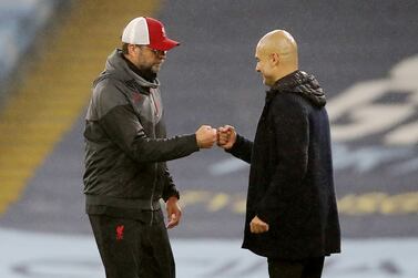 FILE PHOTO: Soccer Football - Premier League - Manchester City v Liverpool - Etihad Stadium, Manchester, Britain - November 8, 2020 Manchester City manager Pep Guardiola and Liverpool manager Juergen Klopp bump fists after the match Pool via REUTERS/Martin Rickett EDITORIAL USE ONLY.  No use with unauthorized audio, video, data, fixture lists, club/league logos or 'live' services.  Online in-match use limited to 75 images, no video emulation.  No use in betting, games or single club /league/player publications.   Please contact your account representative for further details.  / File Photo