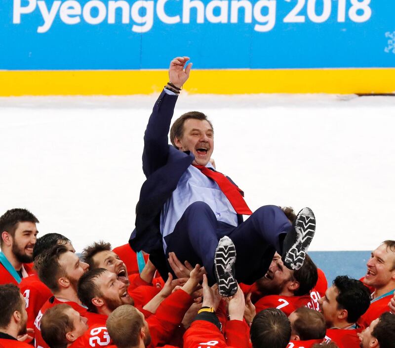 Oleg Znarok, the coach of Olympic Athletes of Russia is thrown into the air by the winning team as they celebrate their win in the Men's Ice Hockey gold medal match at the PyeongChang 2018 Winter Olympic Games. Kimimasa Mayama / EPA