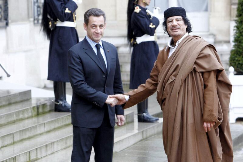 PARIS, FRANCE- DECEMBER 10: French President Nicolas Sarkozy welcomes Colonel Gaddafi at Le palais de l'Elysee on December 10, 2007 in Paris, France. The Libyan leader Muammar Gaddafi will spend five days in France, his first visit in over 30 years, to discuss trade and military deals. (Photo by Michel Dufour/WireImage)