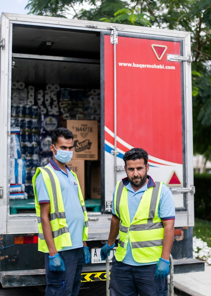 DUBAI, UNITED ARAB EMIRATES. 24 MARCH 2020. Soyab Bhasea, 25, India, and Mohammad Zayed, 31, Pakistan, work for a distributors company, and they deliver goods to supermarkets and warehouses. Mohammad says that he has to continue his work in these times and “Allah Hafiz” (God will protect us).(Photo: Reem Mohammed/The National)Reporter:Section: UAE HEROES