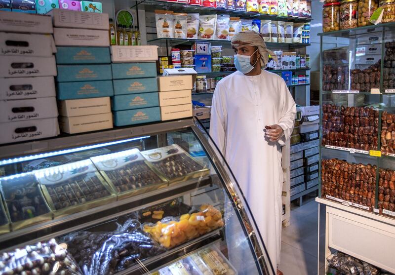 Abu Dhabi, United Arab Emirates, April 16, 2020.  A Ramadan date shopper at the Abu Dhabi Dates Marketat, Mina Zayed.
Victor Besa / The National
Section:  NA
For:  Standalone/Stock Images