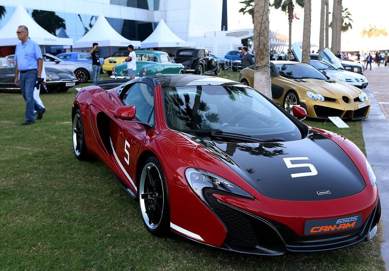 A red and black McLaren 650s.