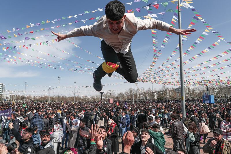 A Supporters of Pro-Kurdish Peoples' Democratic Party (HDP) gets thrown into the air by his friends as they shout slogans during a rally as part of Nowruz (Newroz), or Kurdish New Year, celebrations in Diyarbakir, Turkey, 21 March 2023.  Newroz or Nowruz, which means 'new day' in the Persian language, marks the arrival of spring and the first day in the Iranian calendar.  It is widely celebrated in the Persian and neighboring regions and recognized on the UNESCO List of the Intangible Cultural Heritage of Humanity.   EPA / SEDAT SUNA  ATTENTION: This Image is part of a PHOTO SET