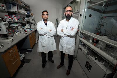 Abu Dhabi, United Arab Emirates - May 22, 2019: An article about research at New York University Abu Dhabi into new ways of delivering anti-cancer drugs into cancer cells. An associate professor at the university, Dr Ali Trabolsi (R), has published a paper showing positive results on cancer cell lines and zebrafish embryos using a type of anti-cancer molecule that his lab has developed. With Prakasam Thirumurugan. Wednesday the 22nd of May 2019. NYU Abu Dhabi, Abu Dhabi. Chris Whiteoak / The National