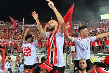 Wydad's players celebrate after winning the CAF Champions League Semi-Final between Egypt's al-Ahly and Morocco's Wydad AC at Stade Mohammed V in the Moroccan city of Casablanca on May 30, 2022.  (Photo by AFP)