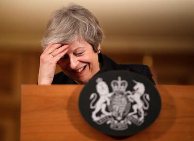FILE - In this Thursday, Nov. 15, 2018 file photo Britain's Prime Minister Theresa May reacts during a press conference inside 10 Downing Street in London. May told lawmakers Wednesday she is prepared to step down "earlier than I intended" in order to win passage of her Brexit divorce deal from the European Union. (AP Photo/Matt Dunham, Pool)
