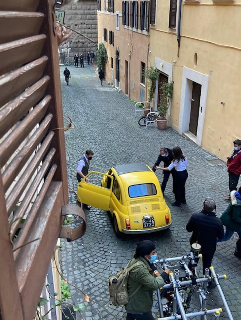 Cruise stands next to a yellow vintage car during the filming of the movie 'Mission: Impossible 7' at the Monti district in Rome, Italy. EPA