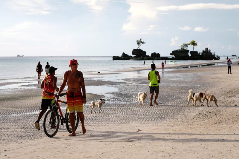 People frolic at the beach.