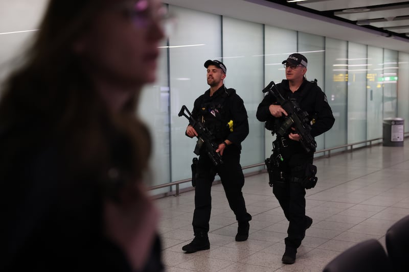 Armed police officers at Gatwick Airport in London, on March 27. Getty