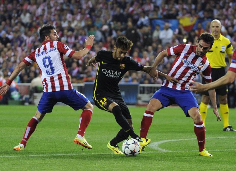 FC Barcelona forward Neymar vies with Atletico Madrid forward David Villa and Atletico Madrid forward Adrian Lopez during the Champions League quarter-final match on Wednesday. Curto de la Torre / AFP / April 9, 2014