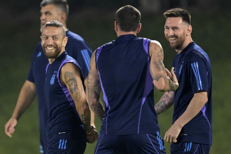 Lionel Messi, Alejandro Gomez and Rodrigo De Paul attend a training session at Qatar University. AFP