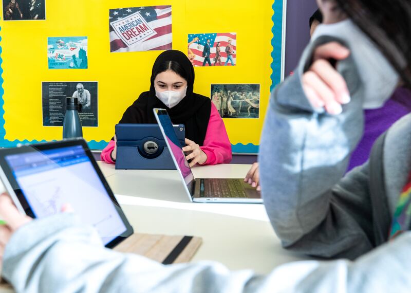 Laptops for lessons American Academy for Girls in Dubai. Technology has bridged the gap between pupils attending in person and those learning remotely.