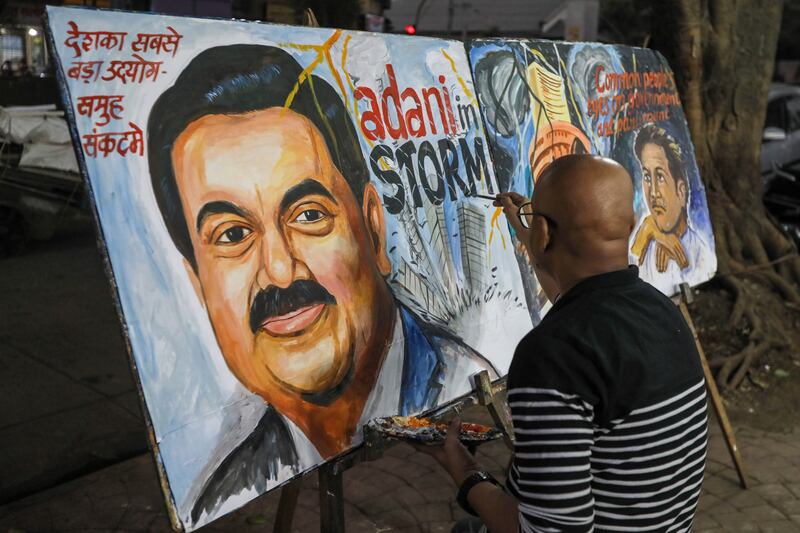 A painting of Gautam Adani, chairman of Adani Group, in Mumbai. The crisis began last month, with a scathing report by US short seller Hindenburg Research. EPA