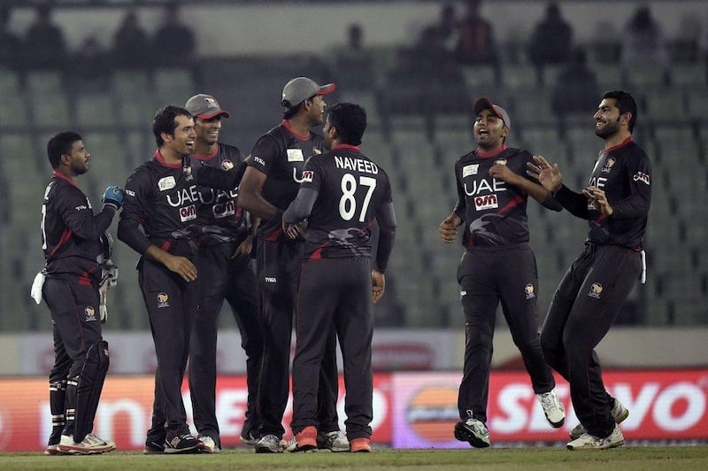 United Arab Emirates cricketers ( Fahad Tariq 2nd right) react after the dismissal of the Sri Lanka cricketer Angelo Mathews (L) during the match between Sri Lanka and United Arab Emirates at the Asia Cup T20 cricket tournament at the Sher-e-Bangla National Cricket Stadium in Dhaka on February 25, 2016. AFP PHOTO/Munir uz ZAMAN