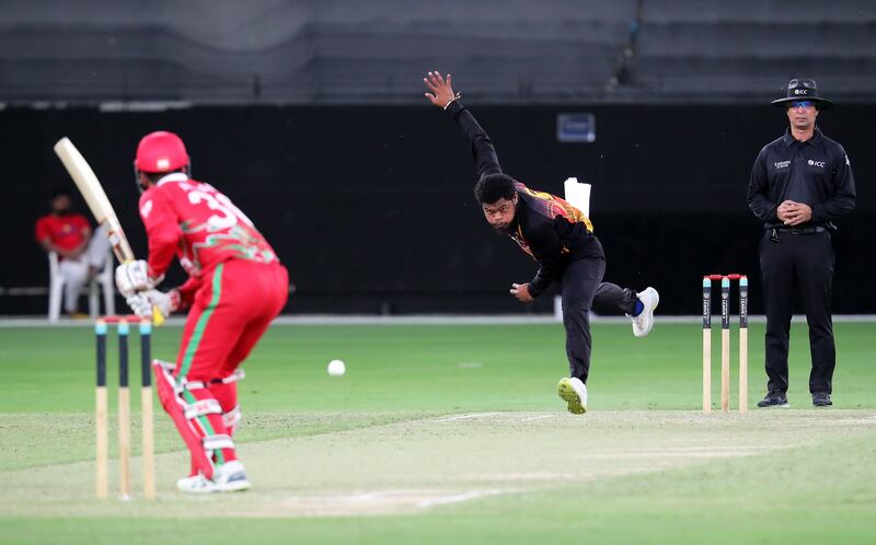 Semo Kamea of Papua New Guinea bowls against Oman.