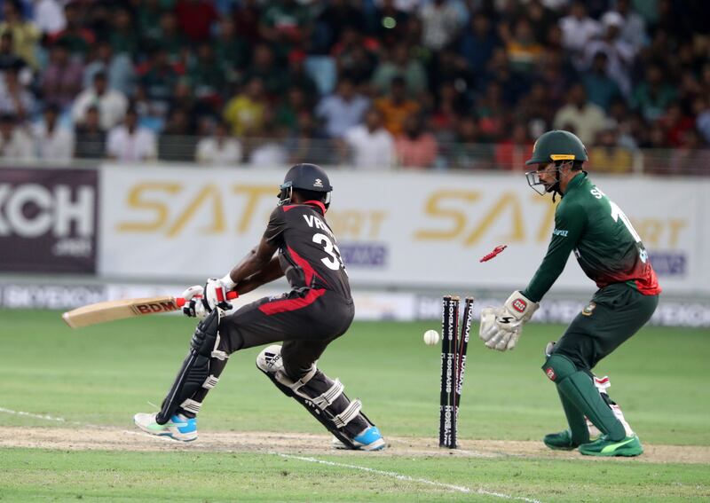 UAE batter Vriitya Aravind is bowled by Bangladesh's Mosaddek Hossain for two.