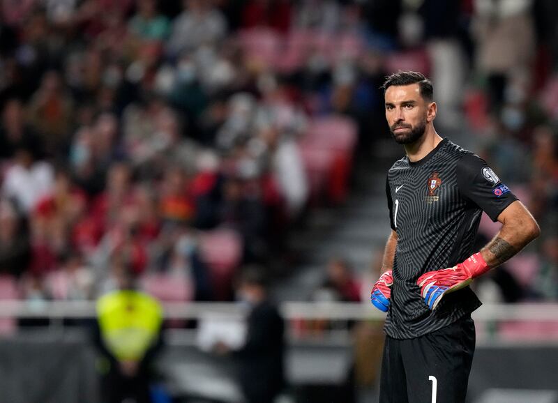 Portugal goalkeeper Rui Patricio reacts after Serbia's Aleksandar Mitrovic scoring his side's second goal. AP Photo