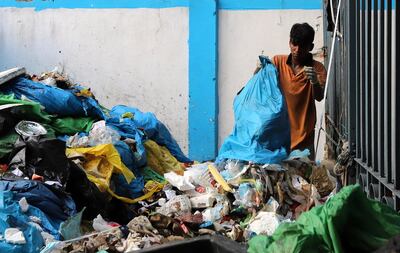 NEW DELHI, INDIA - SEPTEMBER 09: A man works at a pile of medical waste near LNJP hospital in New Delhi, India on September 9, 2020. India recorded its highest novel coronavirus-related fatalities in a day, taking the death toll to 72,775. (Photo by Amarjeet Kumar Singh/Anadolu Agency via Getty Images)