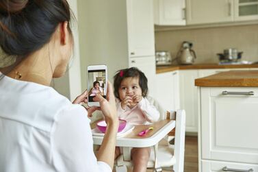 The pressure to share pictures of your children online begins the moment they are born. Getty