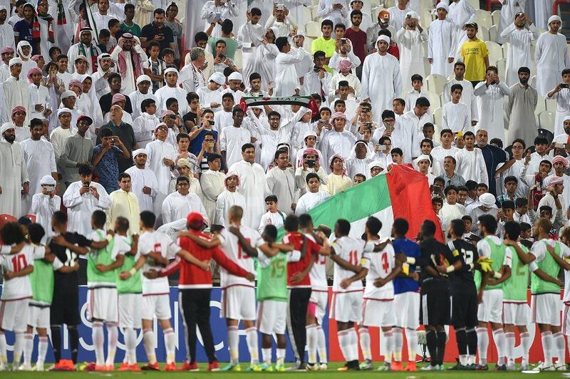 UAE fans celebrate with the team after the match. Tom Dulat / Getty Images