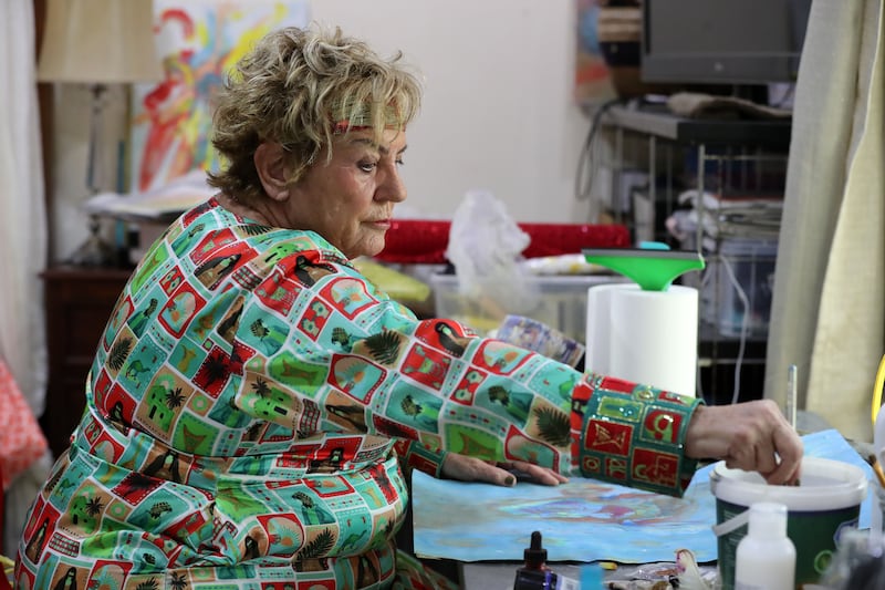 Musch puts the final touches to some of her paintings