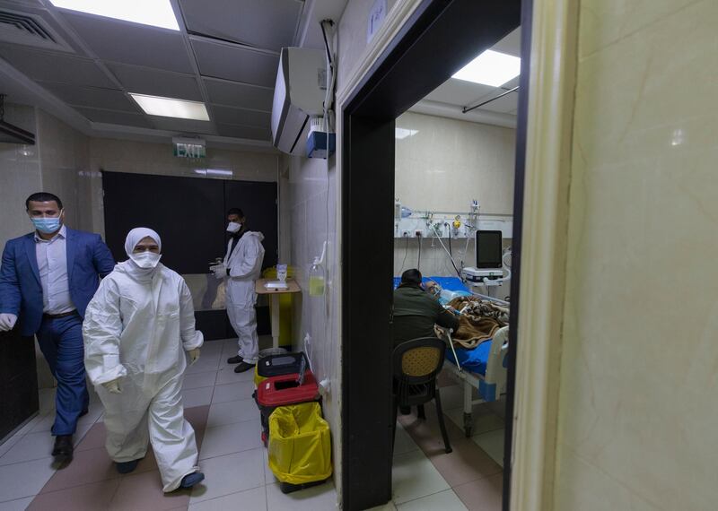 Medical staffers attend a Palestinian patient at the Covid-19 section, in the Palestine Medical Complex, in the West Bank city of Ramallah. AP