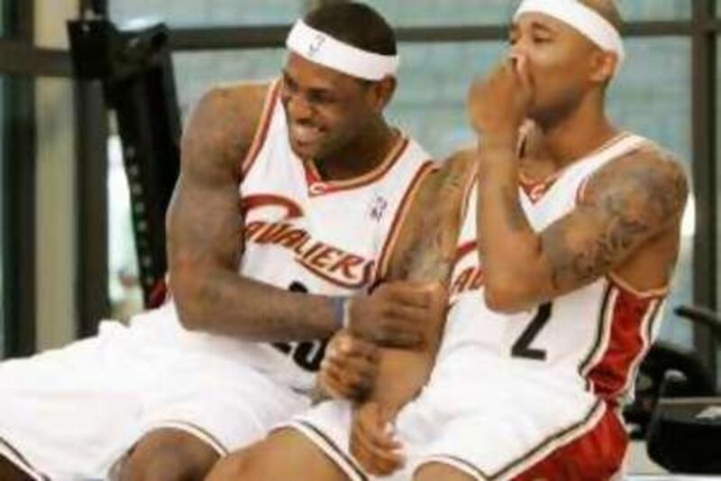 Cleveland Cavaliers' LeBron James, left, jokes with new teammate Mo Williams during the basketball team's media day Monday, Sept. 29, 2008, in Independence, Ohio. (AP Photo/Mark Duncan) *** Local Caption ***  OHMD101_Cavaliers_Media_Day_Basketball.jpg