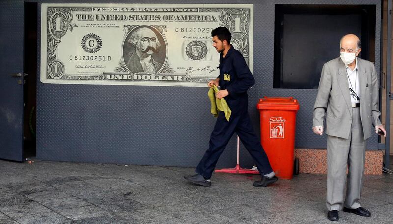 epa08427999 An Iranian man waits for his car in a car wash service in Tehran, Iran, 17 May 2020.  Several countries around the world have started to ease COVID-19 lock-down restrictions in an effort to restart their economies and help people in their daily routines after the outbreak of coronavirus pandemic.  EPA/ABEDIN TAHERKENAREH