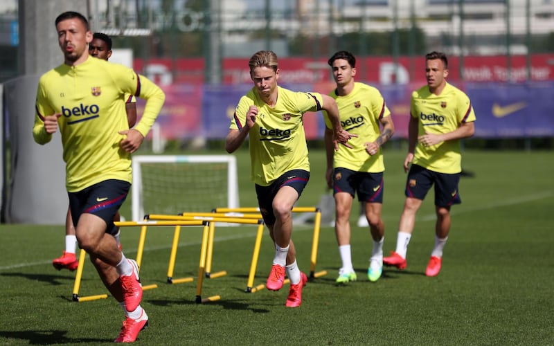 Frankie de Jong and Arthur Melo and defender Clement Lenglet during a training session at Joan Gamper Sports City. EPA