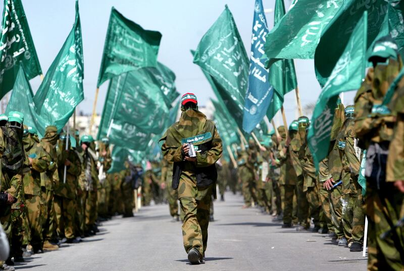 Palestinian militants from Hamas march during a rally in Nuseirat refugee camp in Gaza, April 1, 2005. Reuters