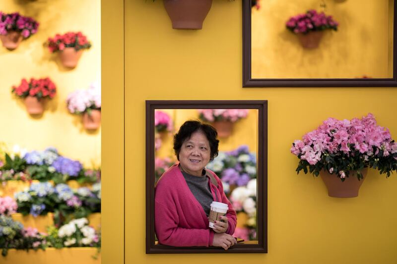 A woman visits a flowers installation in Times Square, Hong Kong. EPA