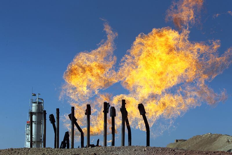 Excess flammable gasses burning from gas flares at the Havana oil field, west of the northern Iraqi city of Kirkuk in 2017. AFP