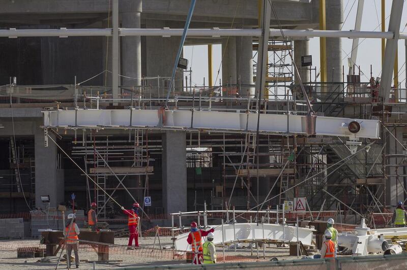 More than 18,000 workers, 42 tower cranes and 35 mobile cranes are currently working on site to keep the project on time. Mona Al Marzooqi / The National