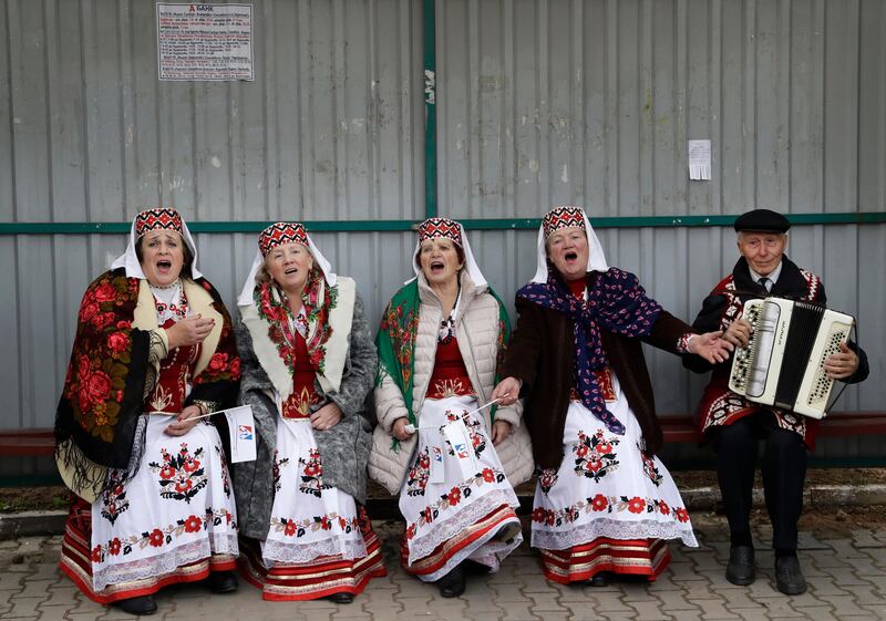 Women wearing Belarusian national dress sing a song as they take part in a national festival marking the end of harvest collection in Smolevichi, 30 km east of the capital Minsk. Sergei Grits / AP Photo