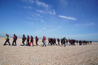 A group of migrants in Dungeness, Kent, after being saved from a small boat on the English Channel this year.