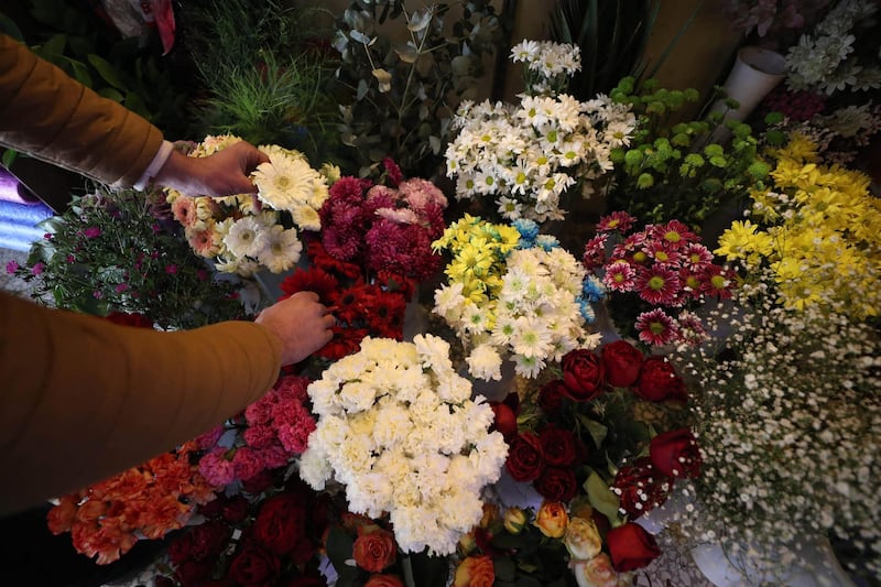 Locally grown fresh flowers are prepared for sale in Syria's Idlib province. AFP