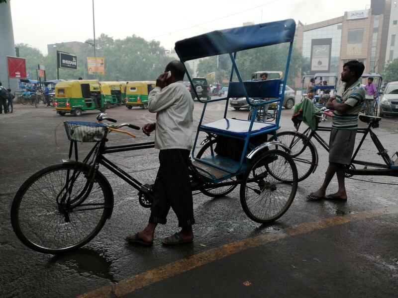 Rickshaw pullers wait for passengers outside a metro station in New Delhi as air quality continuous to remain in hazardous category. Taniya Dutta for The National 