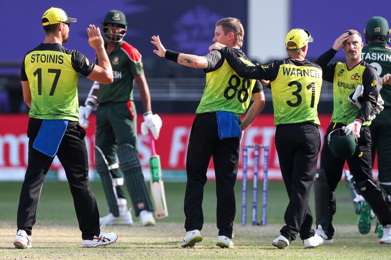 Adam Zampa, centre, returned figures of 5-19 to lead Australia to victory over Bangladesh in the T20 World Cup match in Dubai. AP