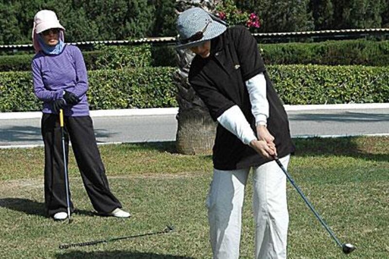 Eida al Mehairbi, left, and Rabab al Haj face a difficult challenge against international players in Tunisia today, but the pair welcome the attention they will draw to women’s golf in the Emirates.