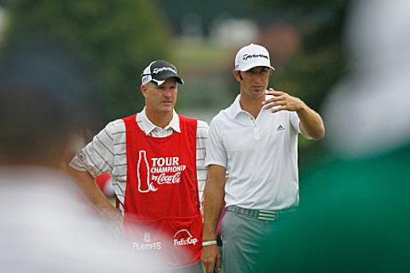 Dustin Johnson, right, waits on the first hole with his former caddie Joe LaCava at last week's The Tour Championship at East Lake.
