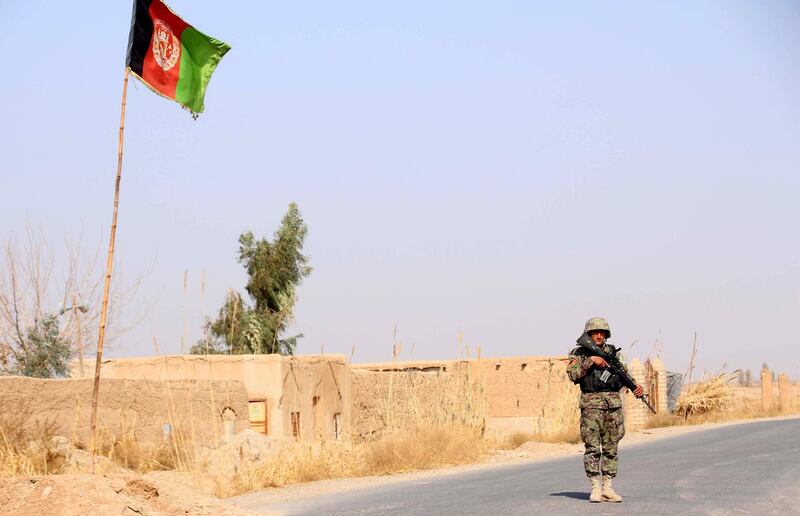 epa06481019 An Afghan Army soldier stands guard at a check point in Helmand, Afghanistan, 28 January 2018. Security has been intensified in Helmand after six Afghan soldiers were killed and four were injured when Taliban attacked in Greshek district of Helmand, Afghanistan.  EPA/WATAN YAR