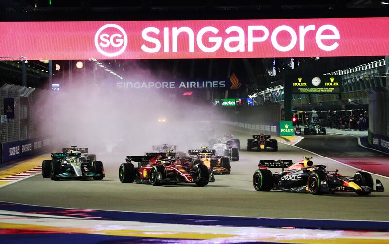 Red Bull's Sergio Perez leads the pack at the Marina Bay Street Circuit. EPA