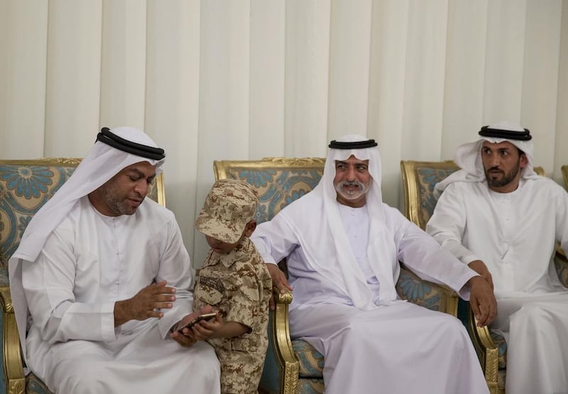 Sheikh Nahyan bin Mubarak, Minister of Culture and Knowledge Development (2nd R) and Mohammed Al Mazrouei, Undersecretary of the Crown Prince Court of Abu Dhabi (R) offer condolences to the family of Saeed Anbar Juma Al Falasi, who died from injuries sustained while serving the UAE Armed Forces in Yemen. Mohamed Al Hammadi / Crown Prince Court - Abu Dhabi