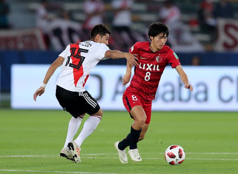Abu Dhabi, United Arab Emirates - December 22, 2018: River Plate's Exequiel Palacios and Antlers Shoma Doi during the match between River Plate and Kashima Antlers at the Fifa Club World Cup 3rd/4th place playoff. Saturday the 22nd of December 2018 at the Zayed Sports City Stadium, Abu Dhabi. Chris Whiteoak / The National