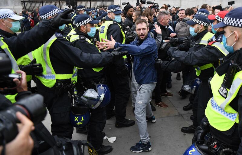 Police clash with protesters during a 'We Do Not Consent' rally at Trafalgar Square in London.  EPA