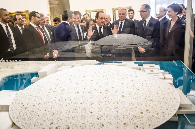 Sheikh Abdullah and Francois Hollande look at a scale model of Louvre Abu Dhabi. Christophe Petit Tesson / AFP